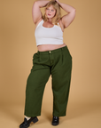 Juliet is 5'7" and wearing 1XL Baggy Mid-Rise Trousers in Evergreen
