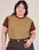 Ashley is 5’7” and wearing L Mismatched Tee in Tan & Brown