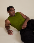 Isaac is 5’10” and wearing S Muscle Tee in Summer Olive