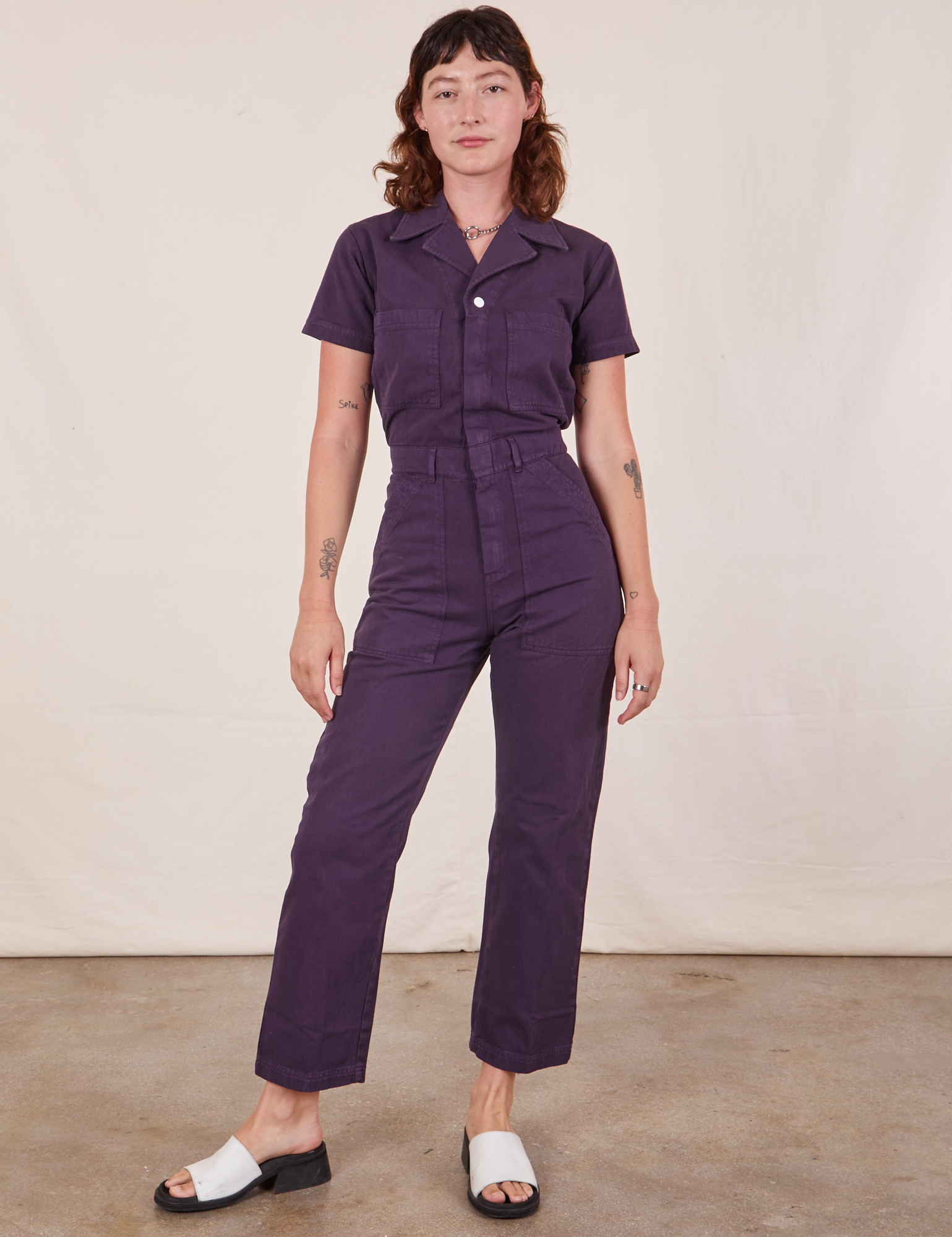 Alex is 5&#39;8&quot; and wearing XS Short Sleeve Jumpsuit in Nebula Purple