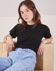 Hana is wearing Organic Vintage Tee in Basic Black tucked into light wash Carpenter Jeans