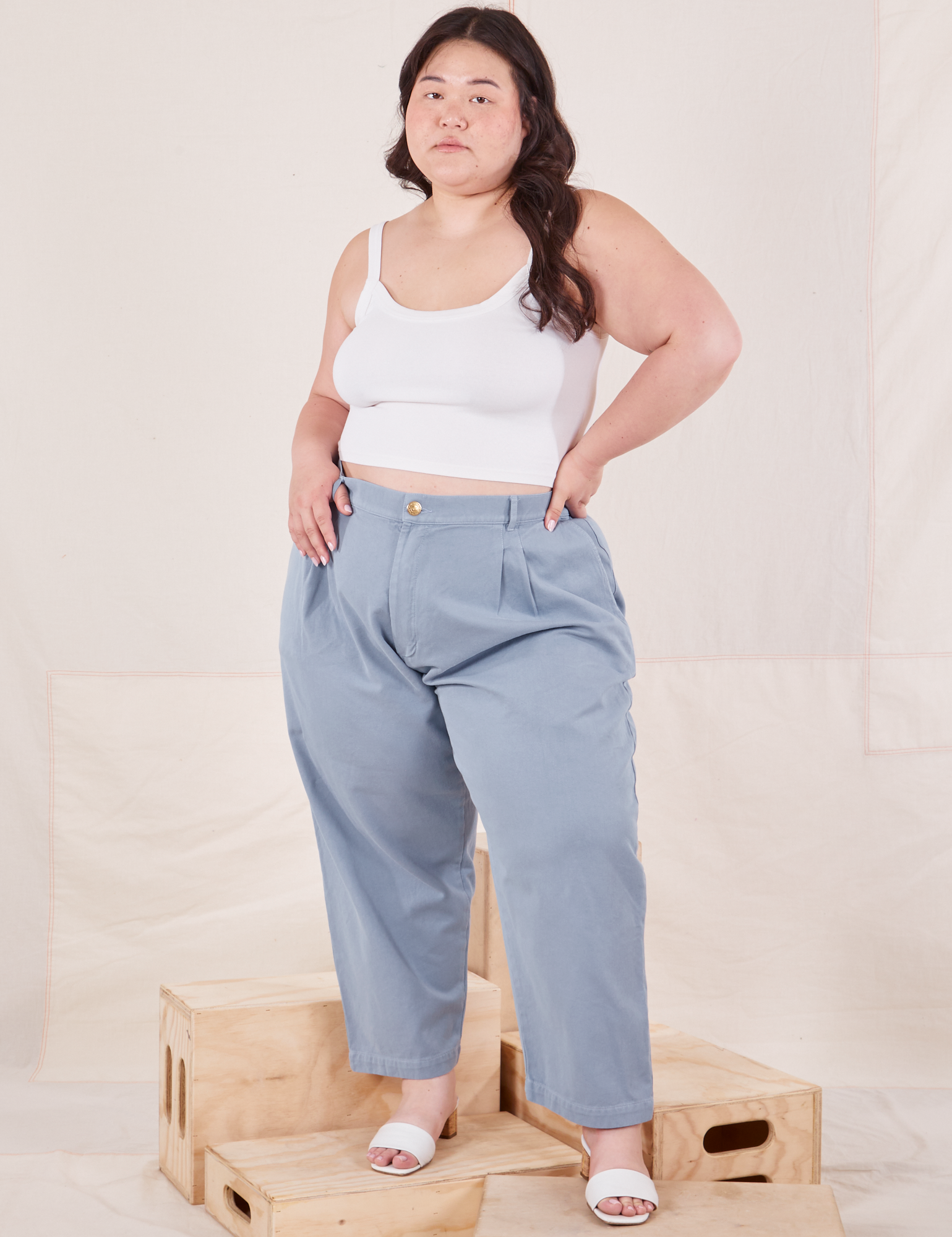 Ashley is 5'7" and wearing 1XL Petite Organic Trousers in Periwinkle paired with Cropped Cami in vintage tee off-white