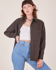 Alex is wearing size P Oversize Overshirt in Espresso Brown paired with a vintage off-white Cropped Tank Top underneath