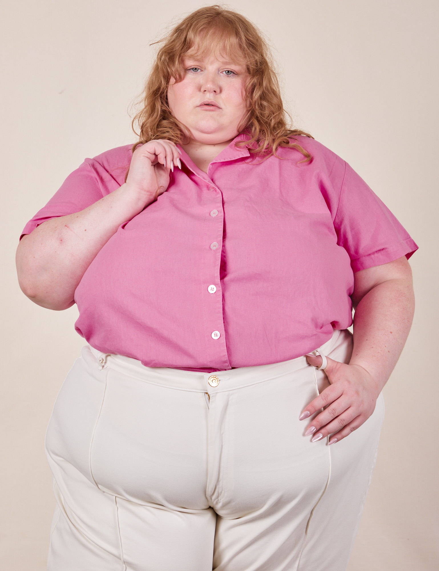 Catie is wearing size 5XL Pantry Button-Up in Bubblegum Pink paired with vintage tee off-white Western Pants