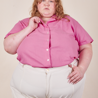 Catie is wearing size 5XL Pantry Button-Up in Bubblegum Pink paired with vintage off-white Western Pants