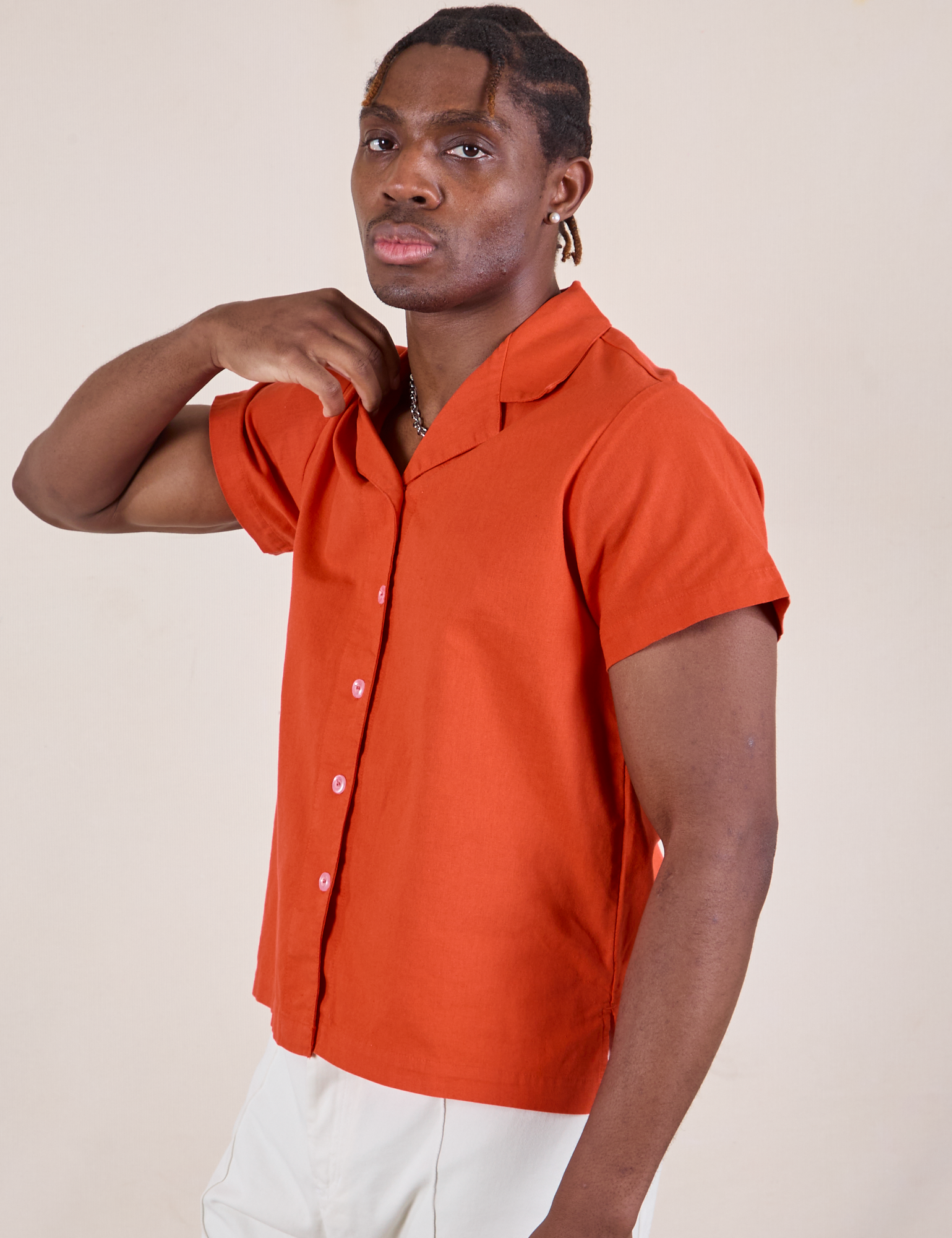 Isaac is wearing Pantry Button-Up in Chili Red