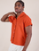 Isaac is wearing Pantry Button-Up in Chili Red