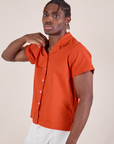 Isaac is wearing Pantry Button-Up in Chili Red