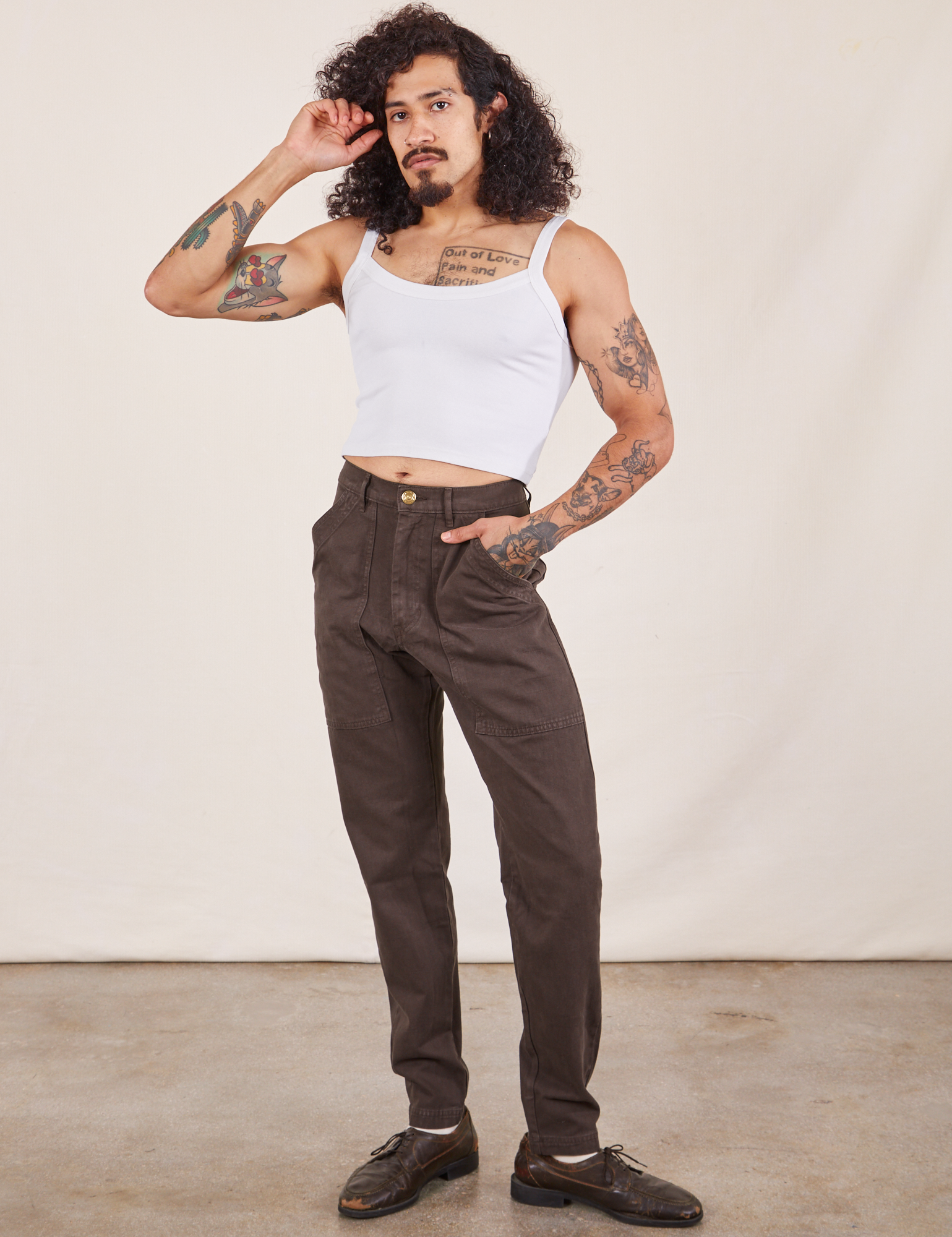 Jesse is 5&#39;8&quot; and wearing XS Pencil Pants in Espresso Brown paired with Cropped Cami in vintage tee off-white