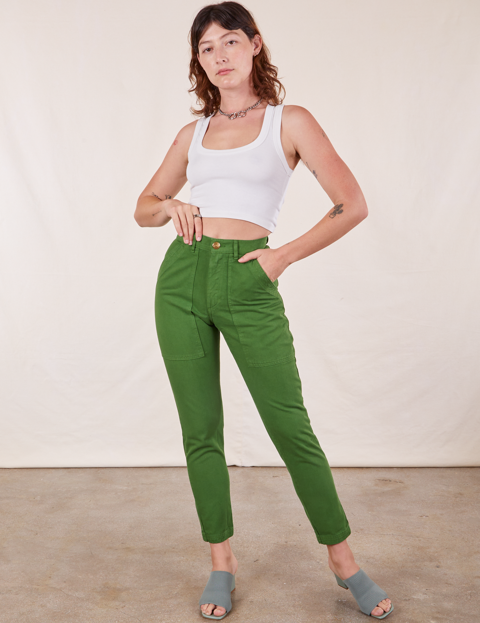 Alex is 5&#39;8&quot; and wearing XXS Pencil Pants in Lawn Green paired with Cropped Tank Top in vintage tee off-white 