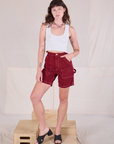 Alex is 5'8" and wearing XXS Railroad Carpenter Shorts in Mustang Red paired with a Cropped Tank in Vintage Tee Off-White