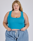 Juliet is 5’7” and wearing L Cropped Tank Top in Hawaiian Blue