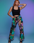 Tiara is 5'4" and wearing S Work Pants in Rainbow Magic Waters paired with a black Cropped Tank