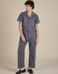 Quinn is 6'3" and wearing L Short Sleeve Jumpsuit in Washed Grey
