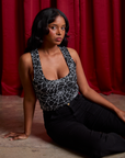 Kandia is wearing Cropped Tank Top in Spider Webs and black Work Pants