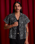 Anthony is 5'6" and wearing S Spider Webs Pantry Button-Up