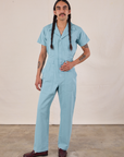 Anthony is 5'10" and wearing S Short Sleeve Jumpsuit in Baby Blue