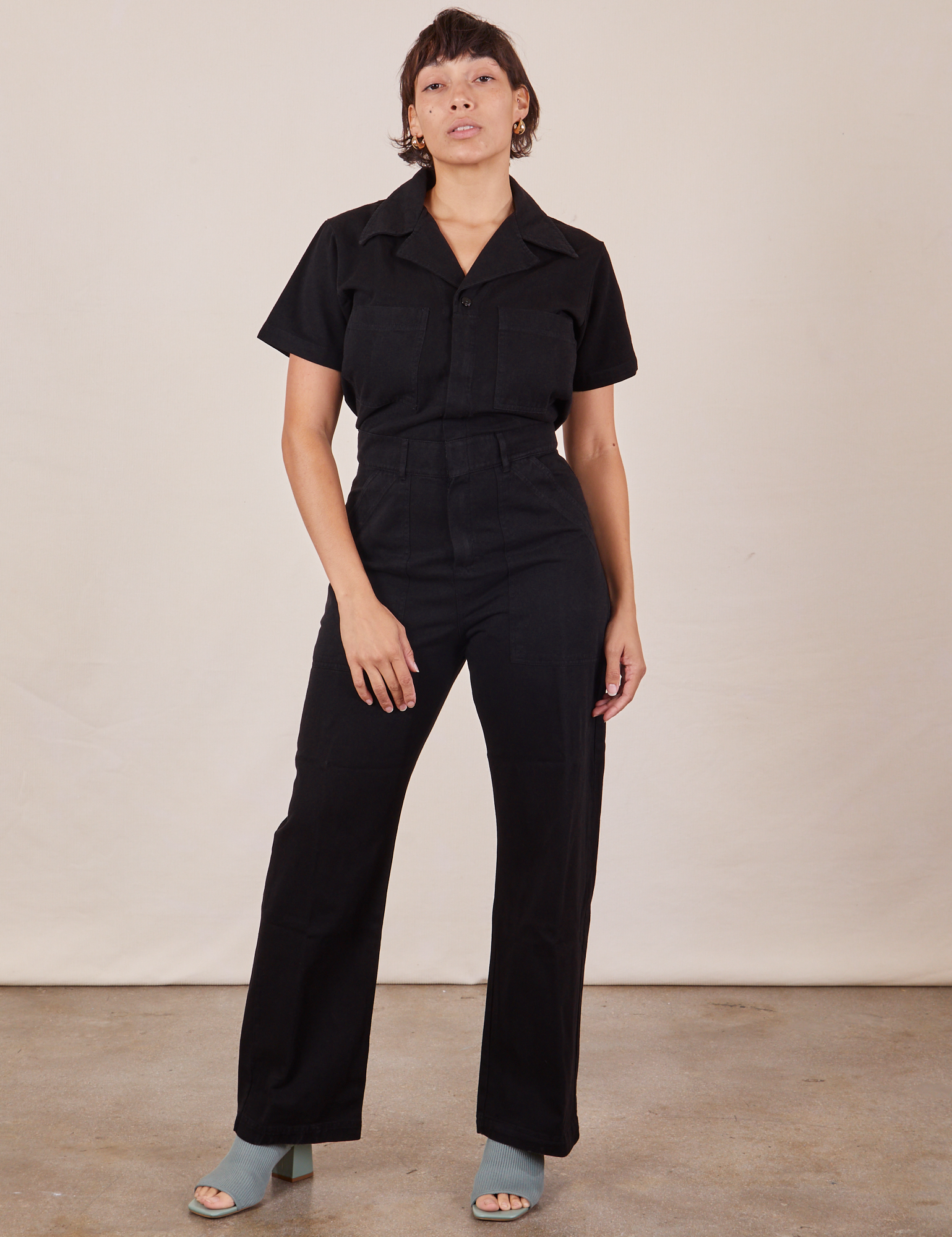 Tiara is 5&#39;4&quot; and wearing S Short Sleeve Jumpsuit in Basic Black