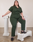 Marielena is wearing Short Sleeve Jumpsuit in Swamp Green