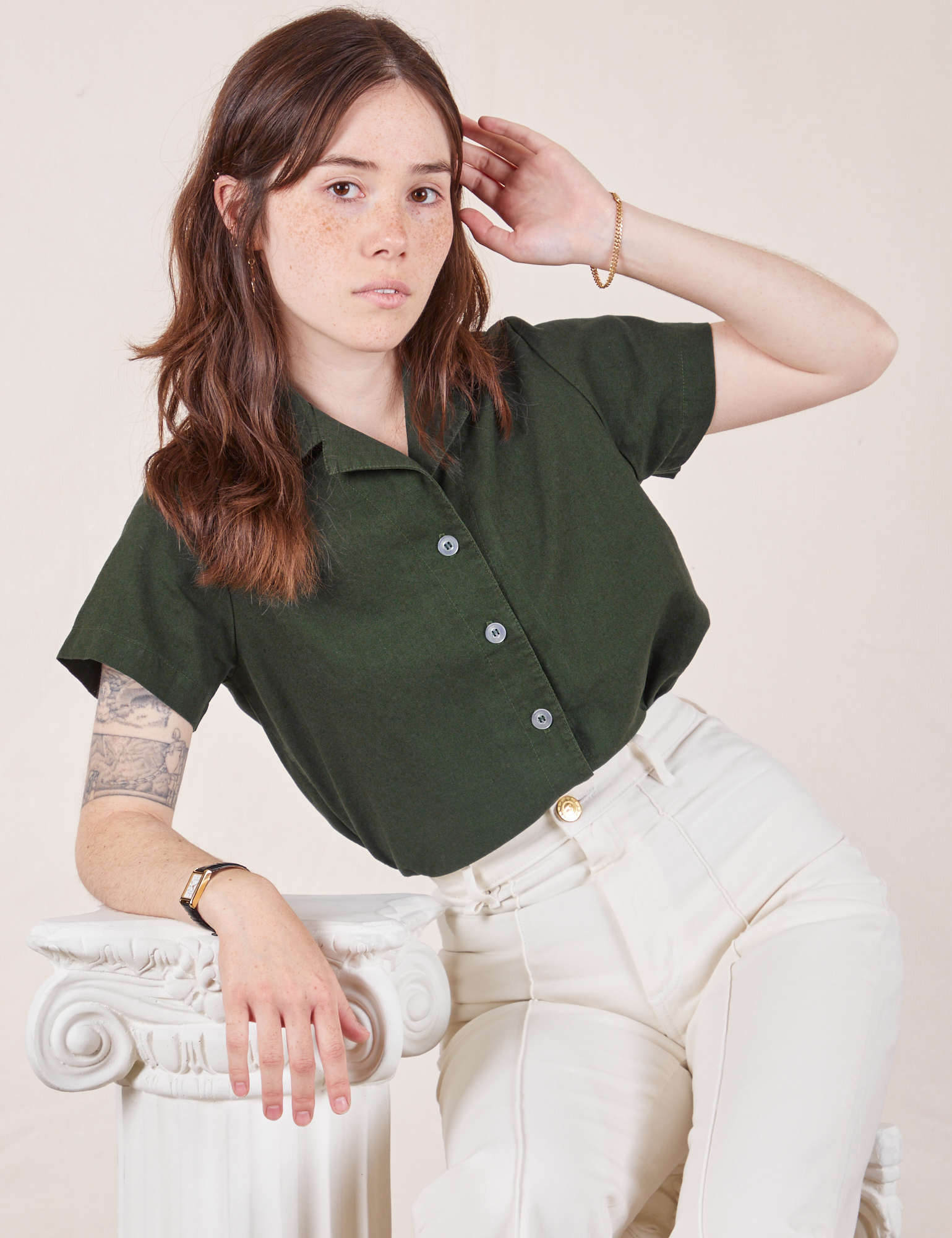 Hana is wearing Pantry Button-Up in Swamp Green and vintage tee off-white Western Pants