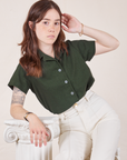 Hana is wearing Pantry Button-Up in Swamp Green and vintage tee off-white Western Pants