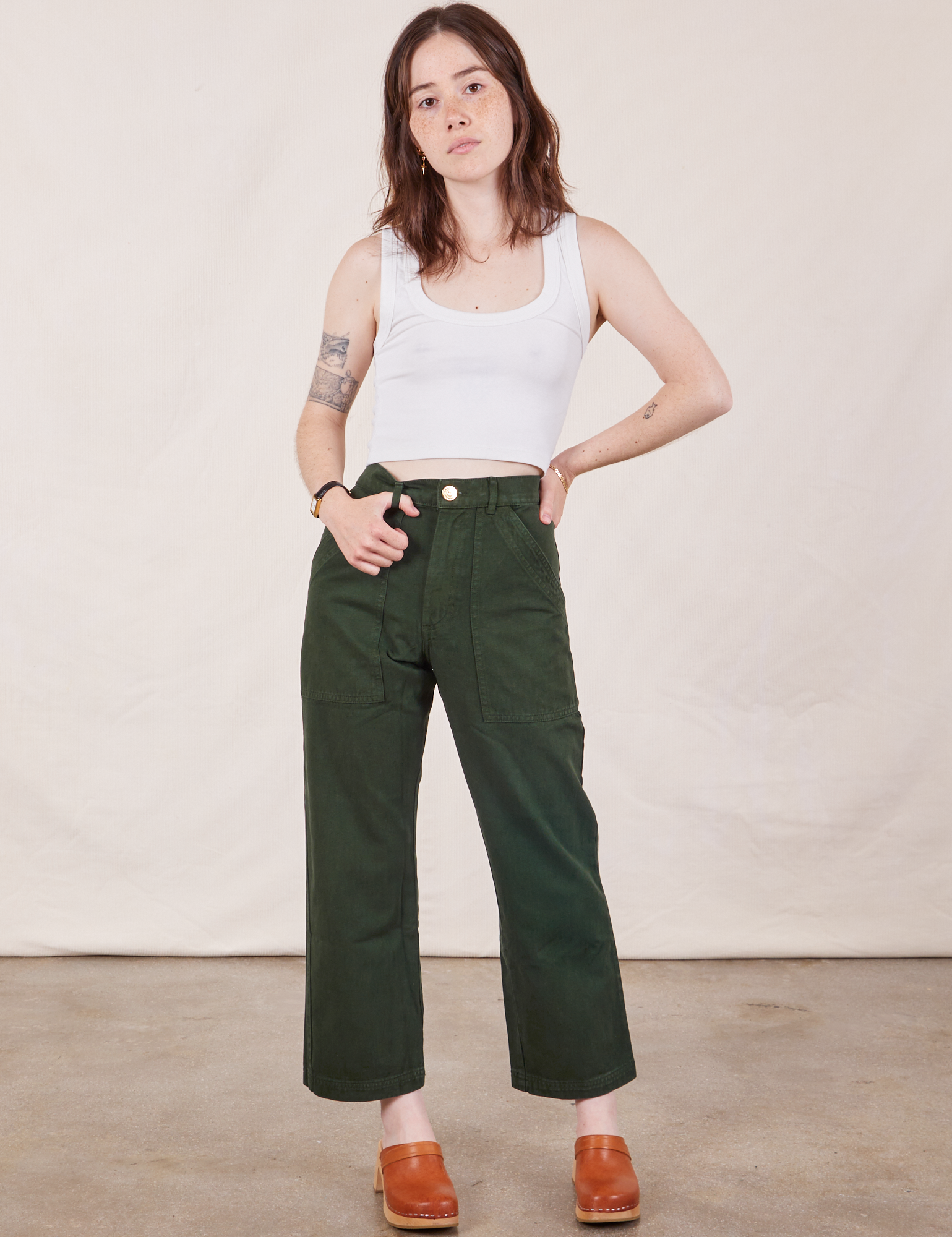 Hana is 5'3" and wearing XXS Petite Work Pants in Swamp Green paired with vintage tee off-white Cropped Tank Top