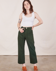 Hana is 5'3" and wearing XXS Petite Work Pants in Swamp Green paired with Cropped Tank Top in vintage tee off-white