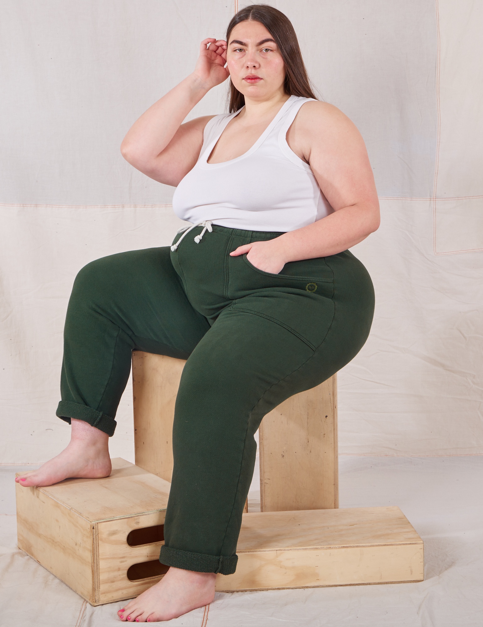 Marielena is wearing Rolled Cuff Sweat Pants in Swamp Green paired with vintage off-white Cropped Tank