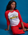 Kandia is wearing the Taxi Raglan Tee in NYC featuring a yellow taxi graphic.