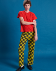 Quinn is 6'3" and wearing M Checkerboard Work Pants in Yellow/Black paired with a mustang red Organic Vintage Tee