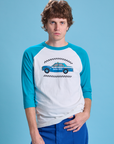 Quinn is 6'3" and wearing M Taxi Raglan Tee in San Francisco. White tee body with blue raglan sleeves.