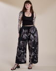 Sydney is 5'9" and wearing L for an oversized look Magic Waters Drop Pocket Pants in Ink Blot paired with black Cropped Tank