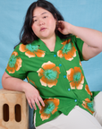 Ashley is wearing Paintstamped Pantry Button-Up in Kelly Green