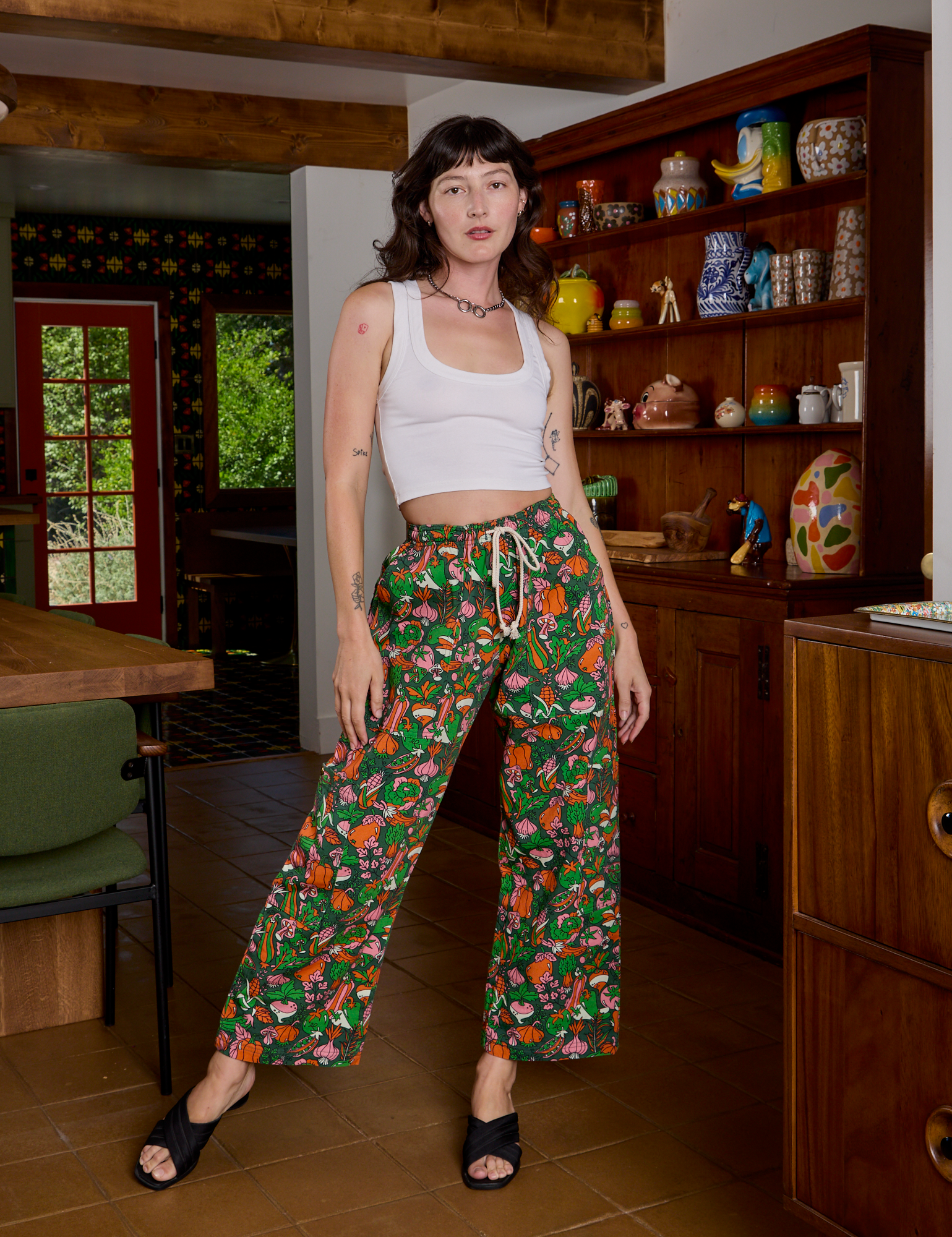Alex is is 5'8" and wearing P Drop Pocket Cargo Pants in Kitchen Collection paired with a Cropped Tank in Vintage Tee White