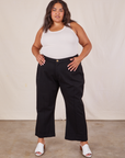 Alicia is 5'9" and wearing 2XL Western Pants in Basic Black paired with a Tank Top in vintage tee off-white