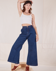 Alex is 5'8" and wearing XXS Indigo Wide Leg Trousers in Dark Wash paired with vintage off-white Cami