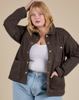 Juliet is 5'8" and wearing L Denim Work Jacket in Espresso Brown