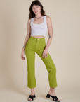 Alex is 5’8” and wearing XS Work Pants in Gross Green paired with vintage tee white Cropped Tank