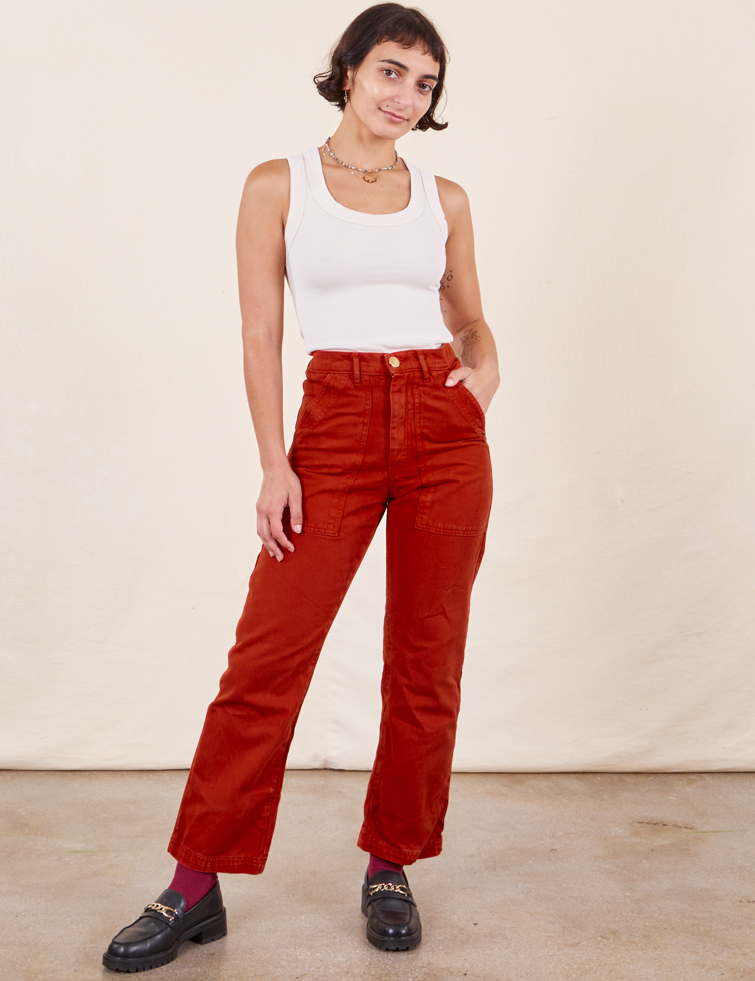 Soraya is 5&#39;2&quot; and wearing Petite XXS Work Pants in Paprika paired with Tank Top in vintage tee off-white 