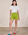 Alex is 5'8" and wearing XS Classic Work Shorts in Gross Green paired with a Burly Tee in Vintage Tee Off-White