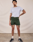 Jesse is 5’8” and wearing XS Classic Work Shorts in Swamp Green paired with a Jr. Varsity Tee in Stone White