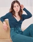 Hana is 5'3" and wearing size 1 Wrap Top in Lagoon