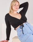 Lish is 5'8" and wearing size 3 Wrap Top in Basic Black