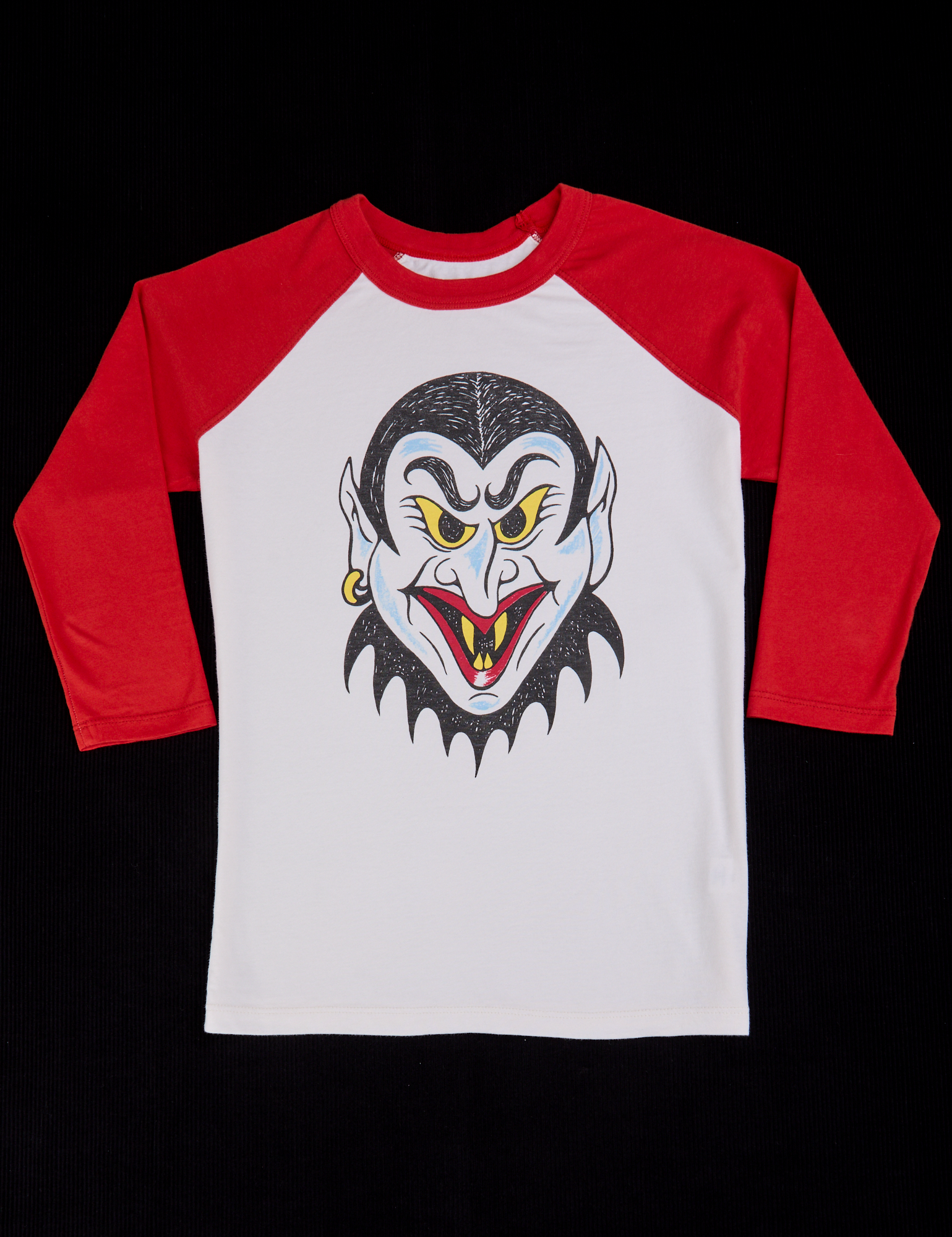 Raglan Tee in Dracula. White body 3/4 sleeve tee with red sleeves.