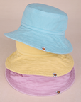 Stacked Wide Brim Denim Bucket Hats in lilac, butter yellow and baby blue