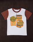 Anniversary Tee in Fast Food. Vintage tee off-white body with fudgesicle brown sleeve and neckline. Graphic of burger, fries and a soda ont he front of tee.