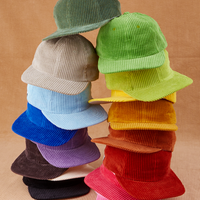 Dugout Corduroy Hat stacked on top of one another in a rainbow of hues