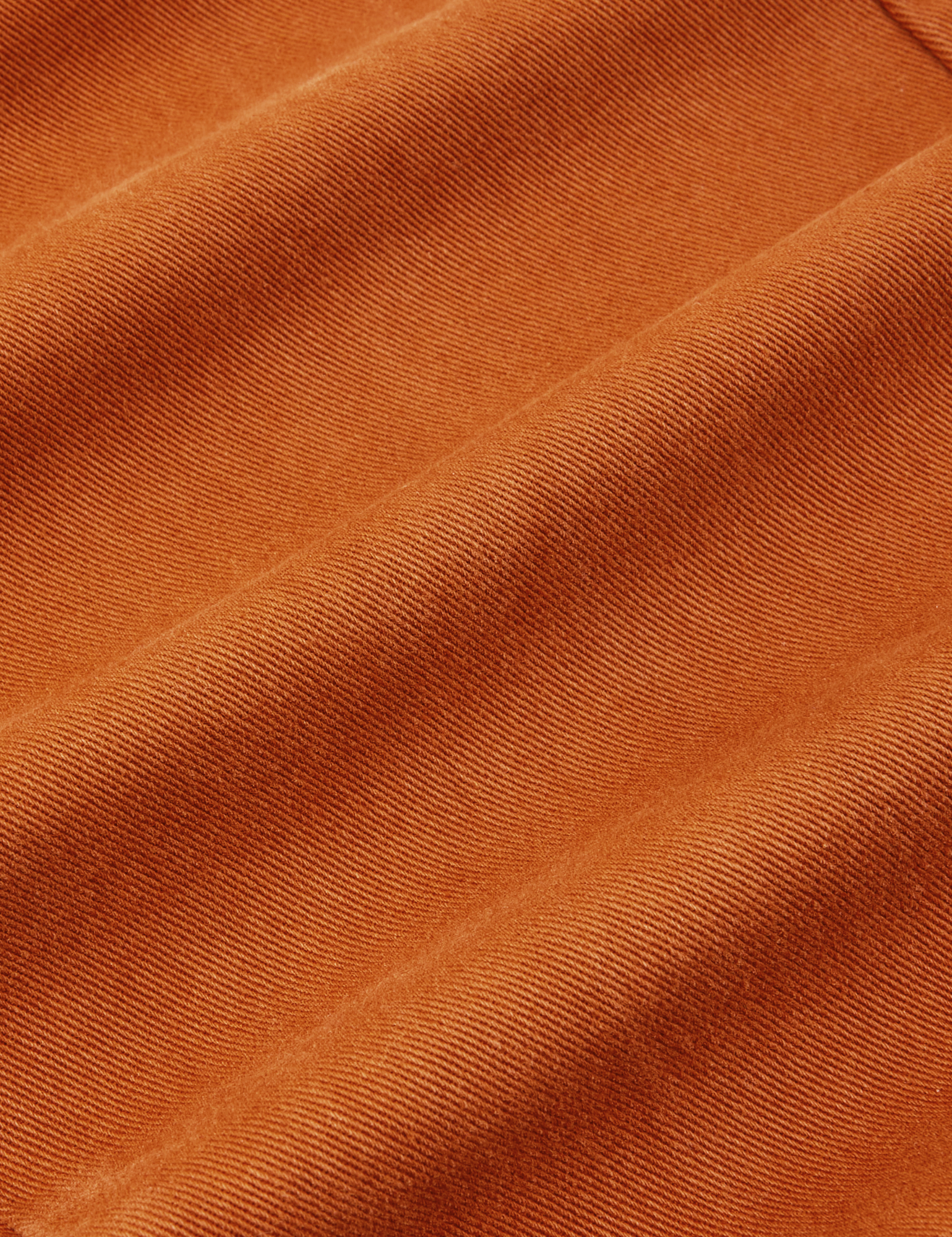 Short Sleeve Jumpsuit in Burnt Terracotta fabric detail close up