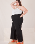 Side view of Bell Bottoms in Basic Black and Cropped Cami in vintage tee off-white on Marielena