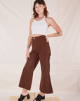 Angled view of Bell Bottoms in Fudgesicle Brown and Halter Top in vintage tee off-white on Alex